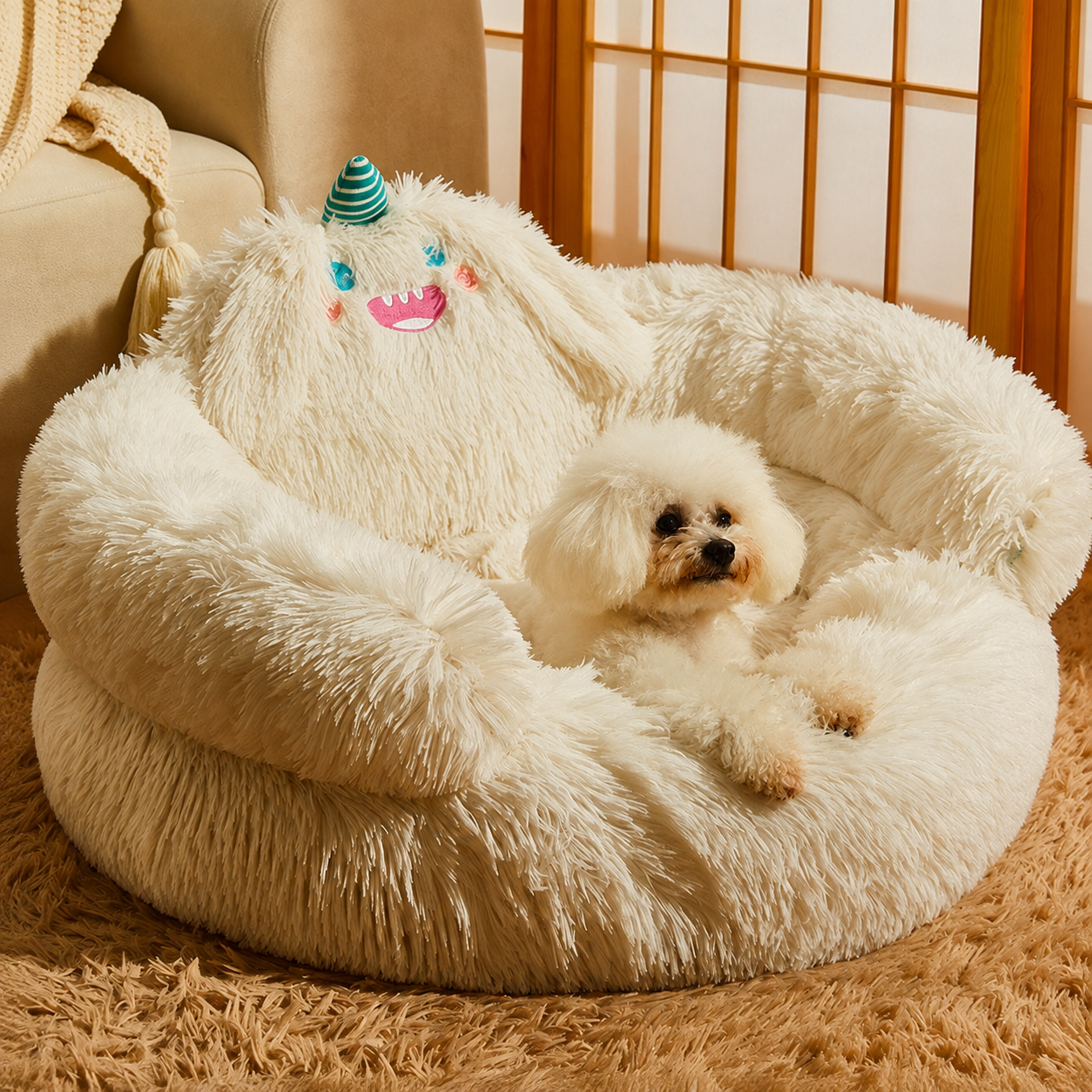 White shaggy plush pet nest bed with playful horn detail and a small white dog