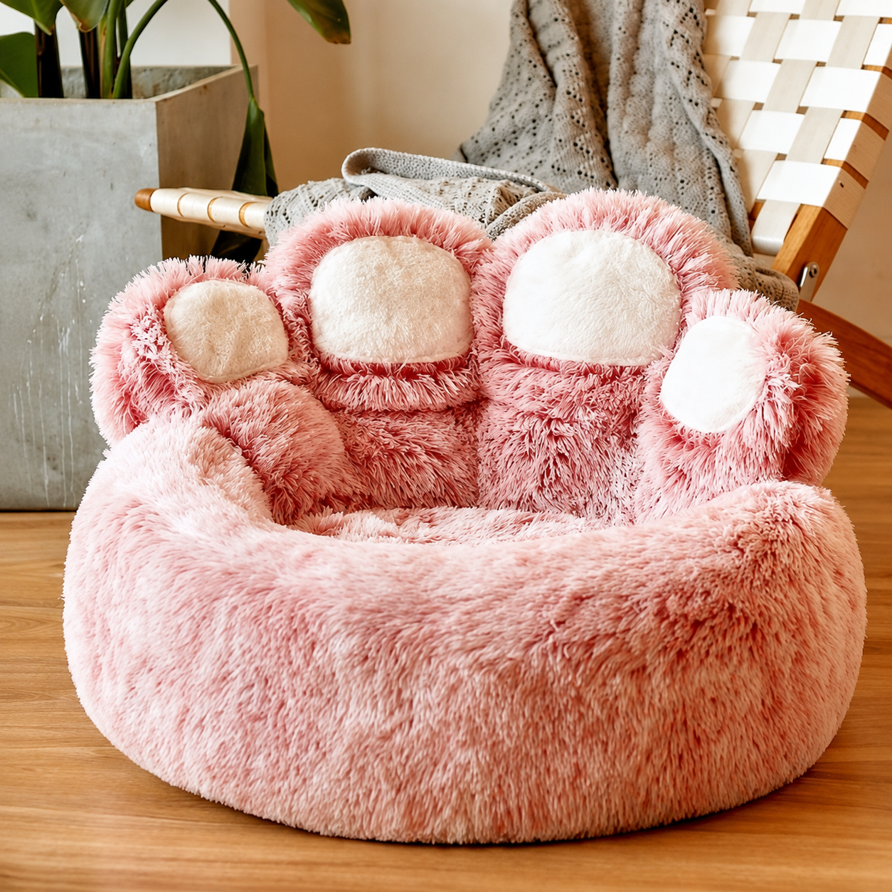 Pink paw-shaped plush pet nest bed, product-only angled view