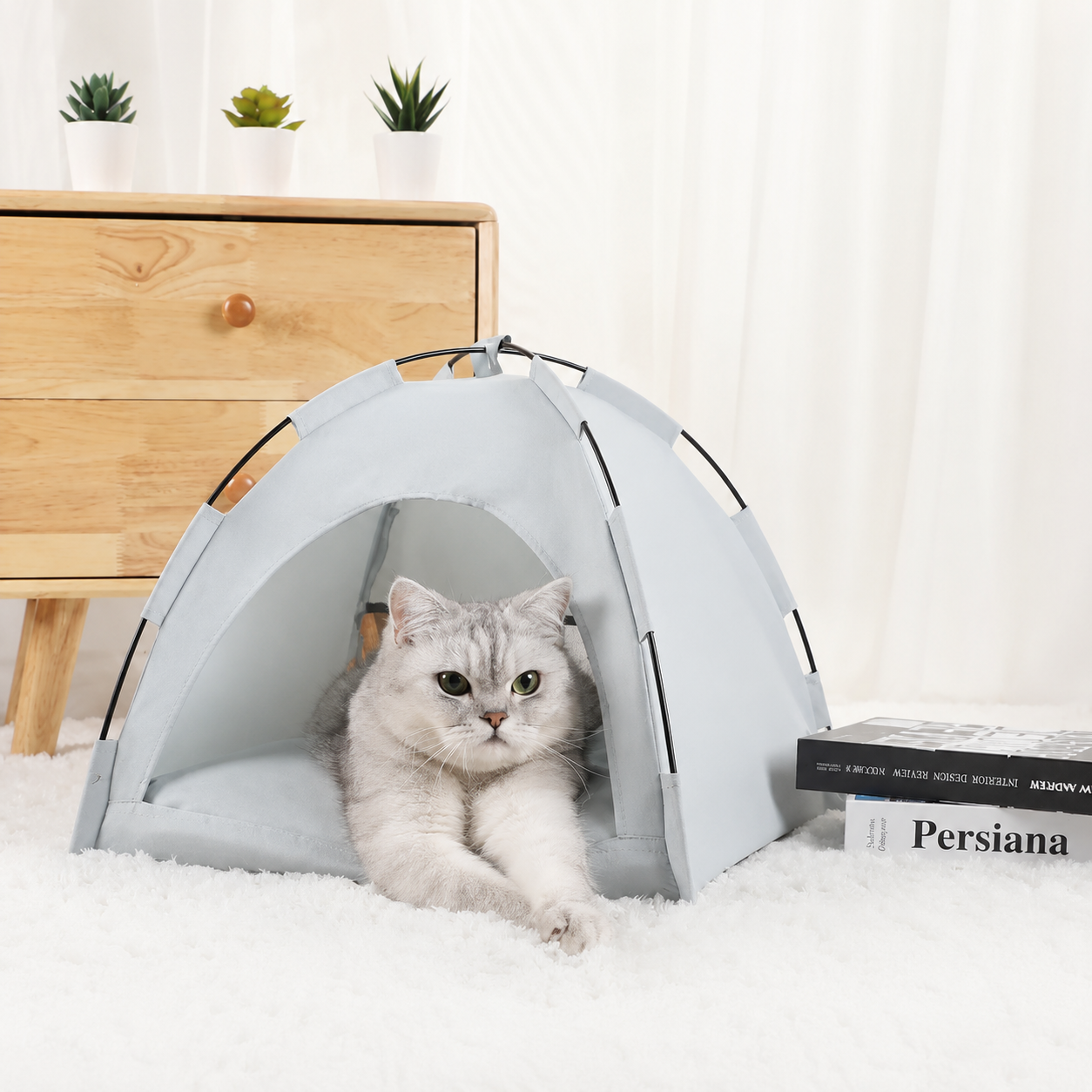 Blue grey washable pet sleeping tent with a silver tabby cat, front view