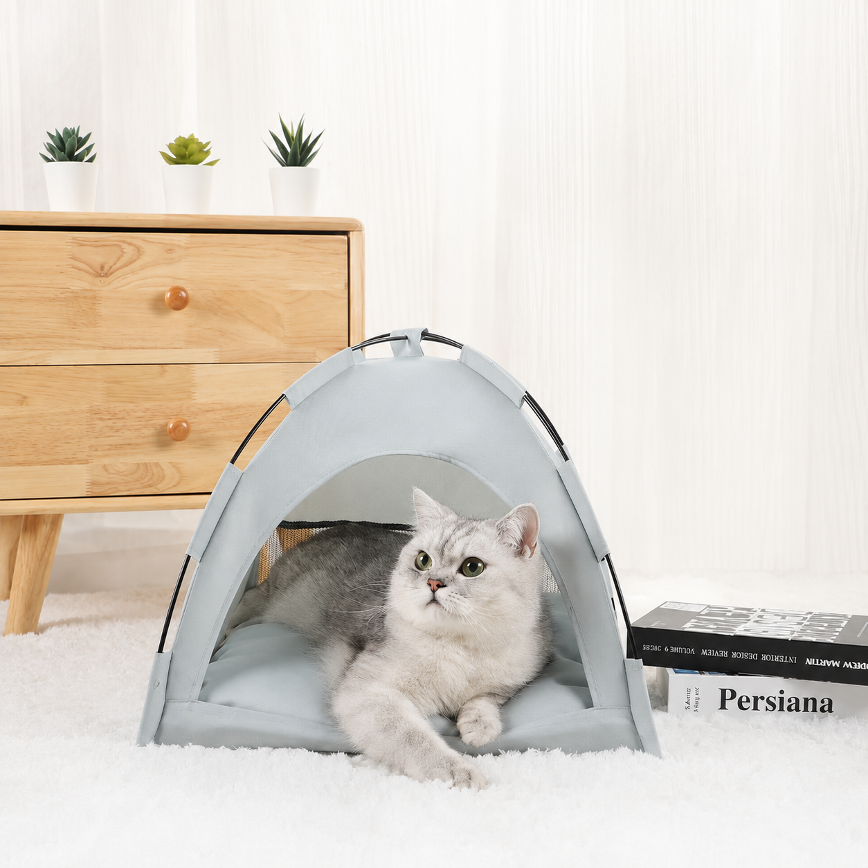 Blue grey washable pet sleeping tent with a silver tabby cat resting inside